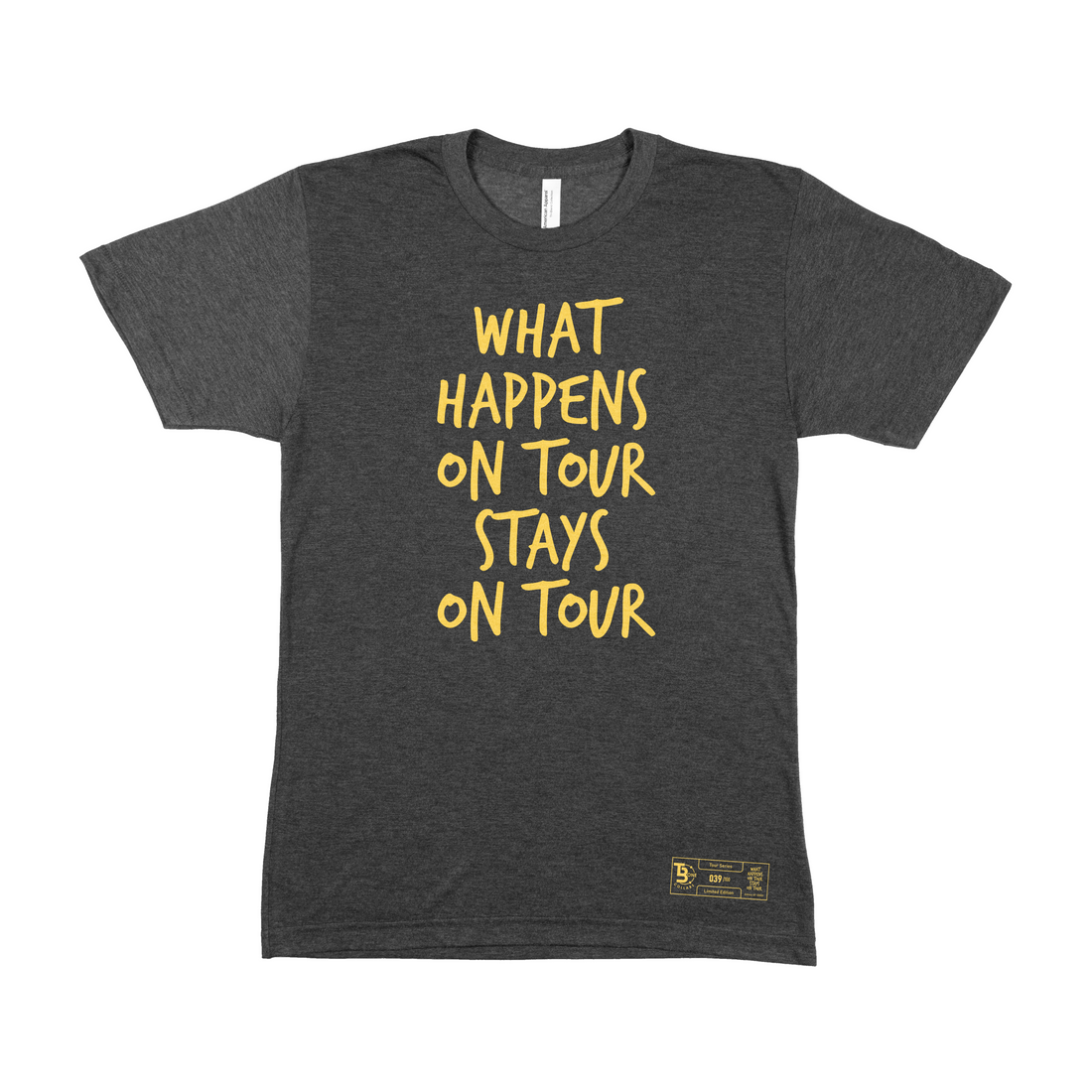 Front view of TBone Collabs' 'What Happens on Tour, Stays on Tour' triblack t-shirt, showcasing a vibrant yellow text graphic. A detailed numbered label is visible at the bottom left