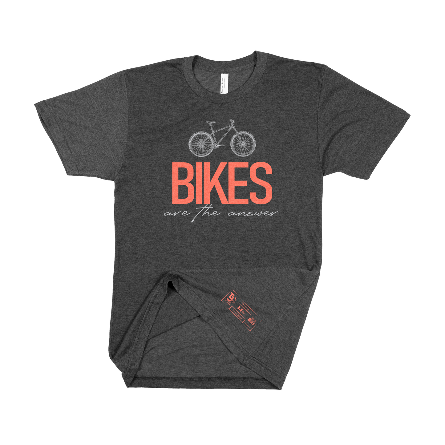 Charcoal-colored, tri-blend t-shirt featuring a central mountain bike graphic and the 'Bikes Are the Answer' phrase with 'Bikes' in orange. Near the bottom left is a numbered label detailing the edition, quantity produced, the small TBone logo, and a miniaturized version of the t-shirt's graphic logo.