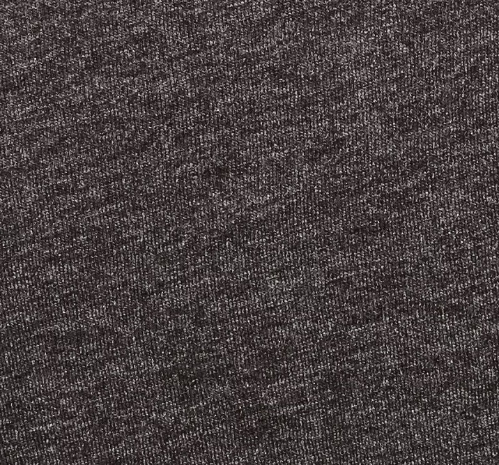 Close-up view of the unique texture of the triblend t-shirt, highlighting the fine and detailed weaving pattern that offers a superior comfort and durability.